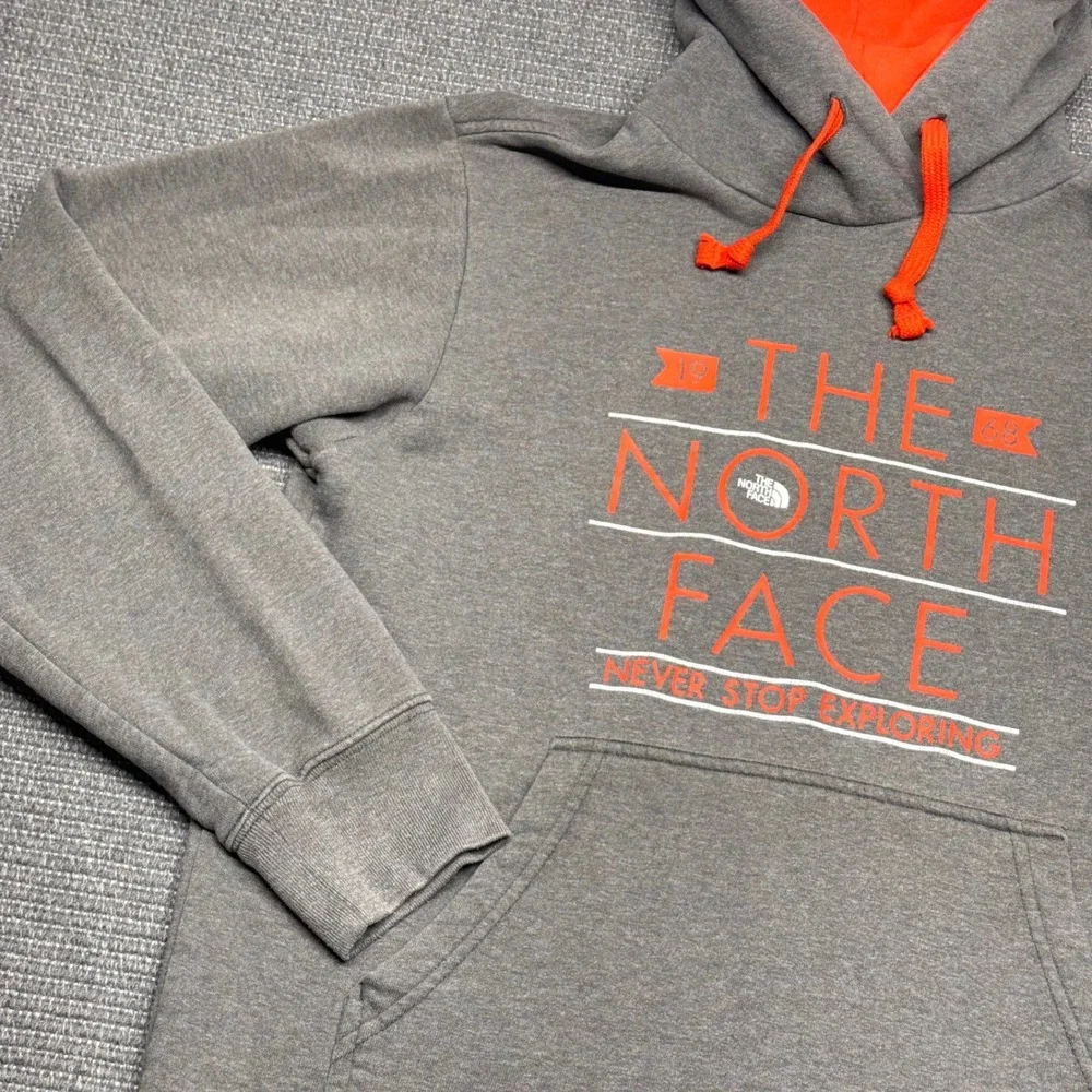 The North Face Mens Grey Orange Graphic Pullover Hoodie Never Stop Exploring Med